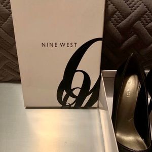 Women’s Nine West peep toe pumps. Size 8
